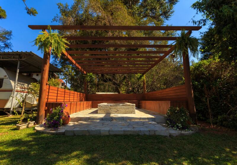 Backyard pergola with stone floor