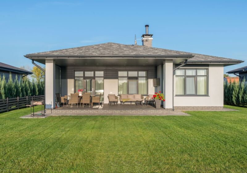 New home with fresh sod and covered patio
