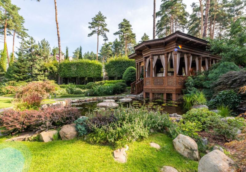 Layered planting beds around a garden pavilion